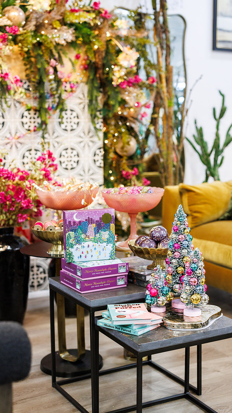 Holiday star, nutcracker cushion, and festive décor styled in the store.